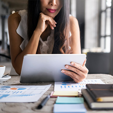 Home-DI-card diversified investments - woman looking at tablet